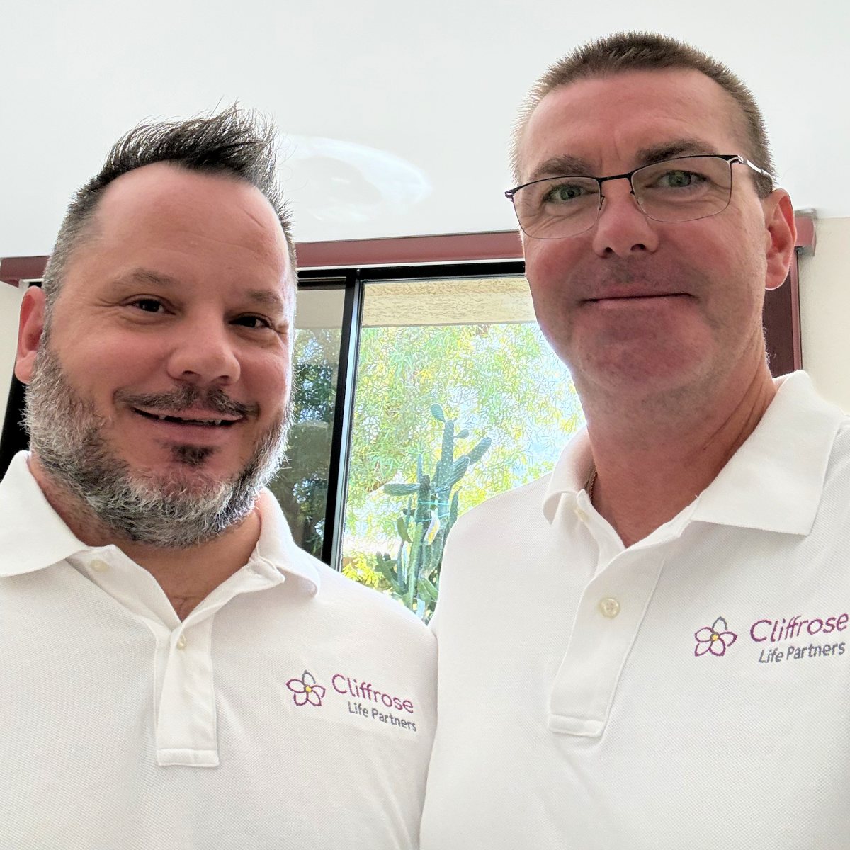 Nicholas and Philip in their Cliffrose Life Partners shirts at home in Palm Springs