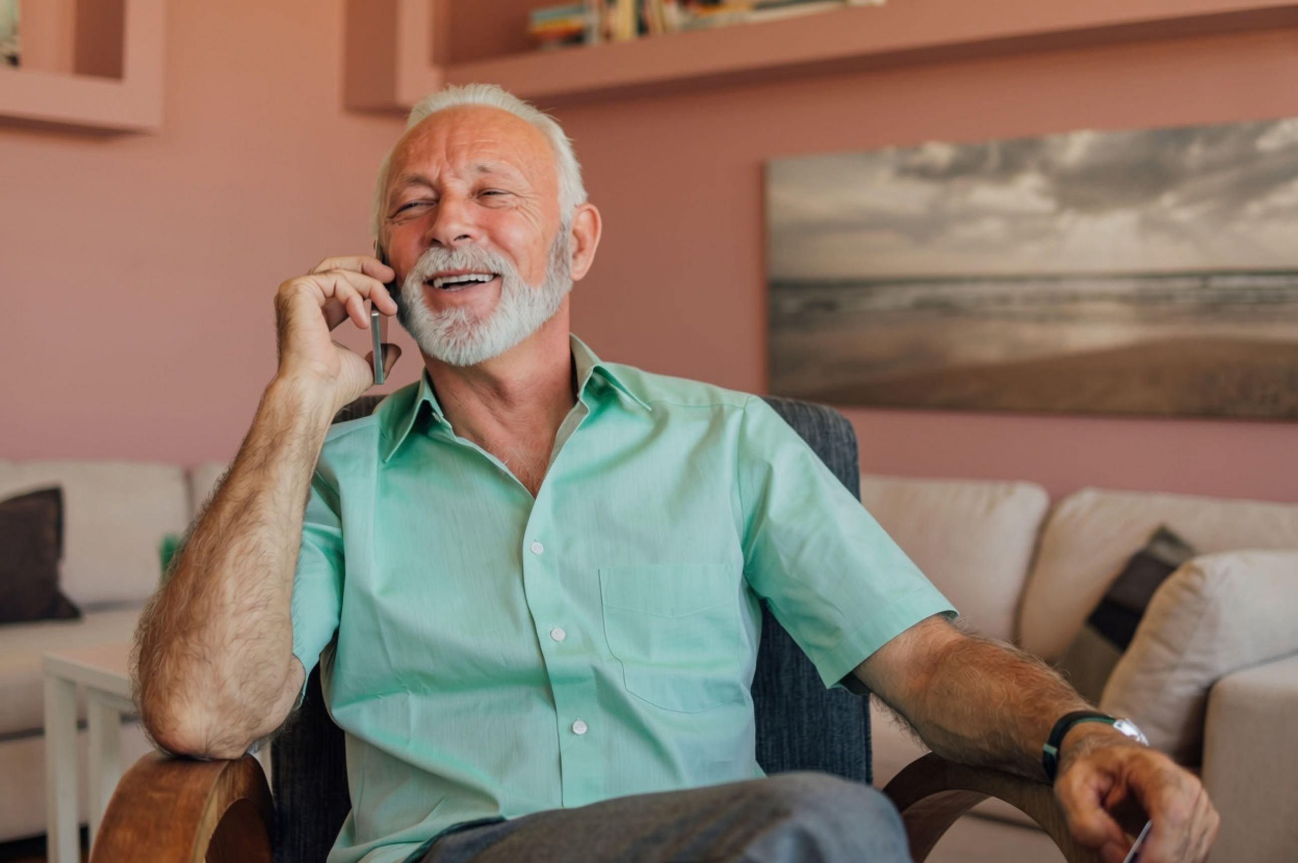 A Palm Springs homeowner relaxing at home while talking on the phone